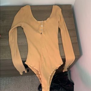 shinestar tan long sleeve body suit, small.